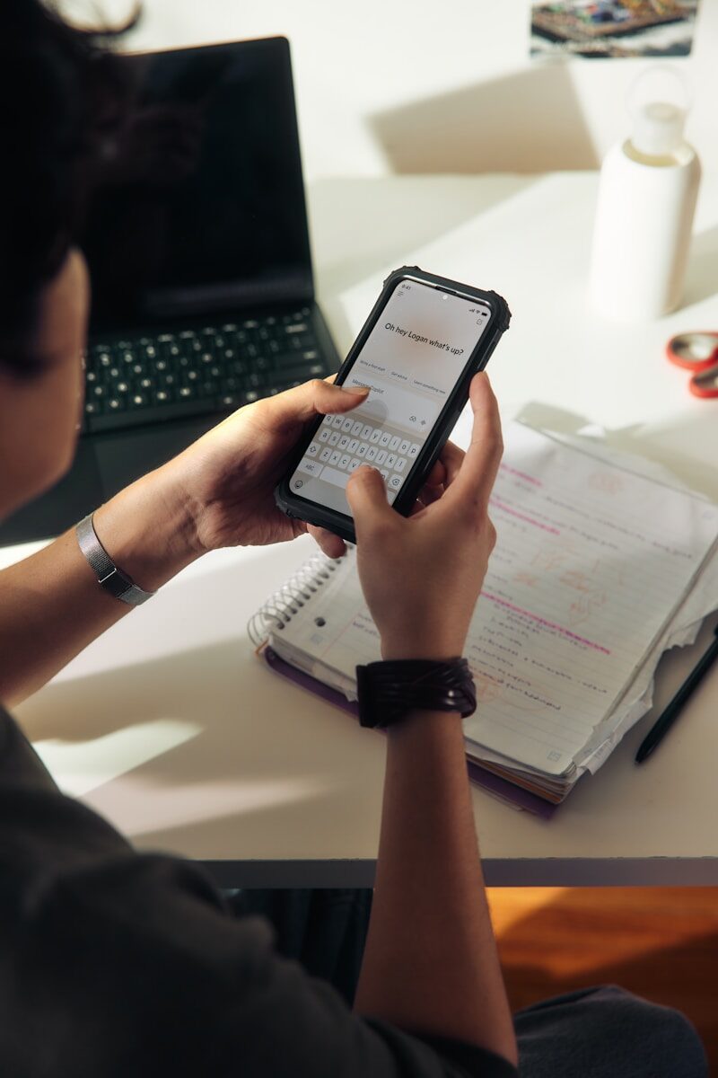 Person using a smartphone to review calendar